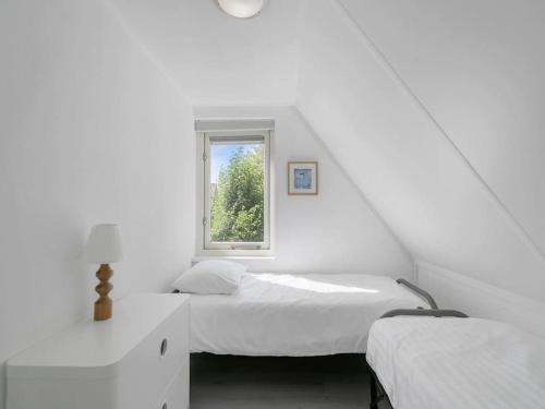 Llit o llits en una habitació de Holidayhouse Zeeland