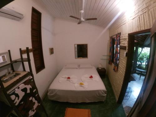 Una cama o camas en una habitación de Pousada Ibirapuera