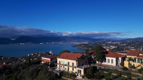 a house on a hill with a view of a lake at DEMIVIE GUESTHOUSE in Lerici