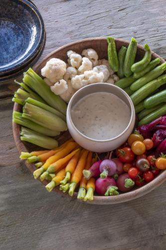 a plate of vegetables with a bowl of dip at La Sultana Oualidia in Oualidia