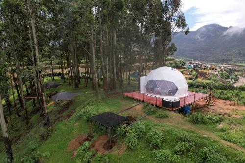an aerial view of a tent in the woods at Kanal Glamp Kodaikanal Luxuries in Kodaikānāl