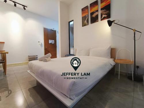 a bedroom with a bed with a sign on it at Imperio Residence Melaka by Jeffery Lam Home Management in Melaka