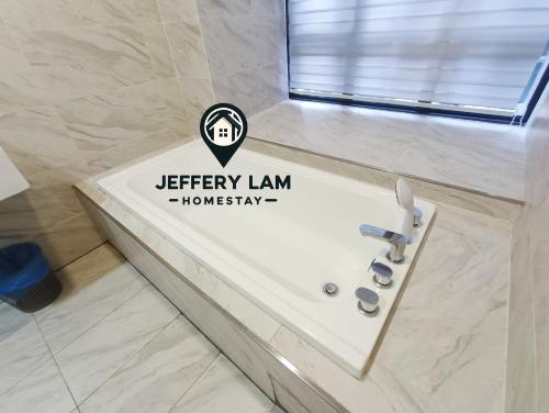 a bathroom with a sink with a sign on it at Imperio Residence Melaka by Jeffery Lam Home Management in Melaka