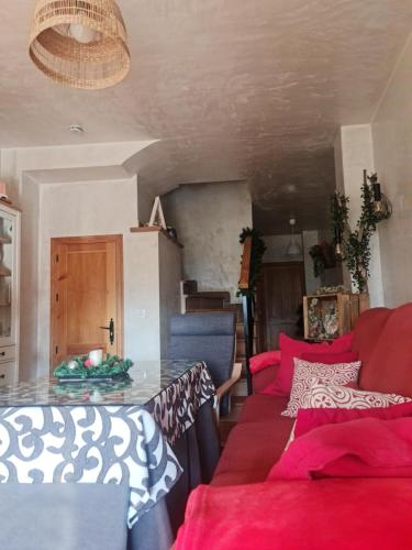 a living room with a couch and a table at Entre Vistas in Zahara de la Sierra