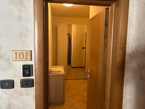 a hallway with a door leading into a room with a door at Albergo La Grolla in Antey-Saint-André