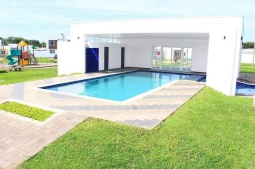 a swimming pool in the yard of a house at Vivienda familiar in San Miguel