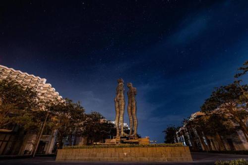 a statue of two people standing on top at K' SEA VIEW ARENA RESORT o in Miếu Ông
