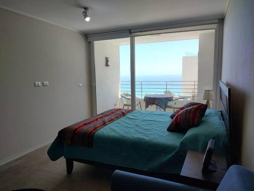 En eller flere senge i et værelse på Departamento con vista al mar
