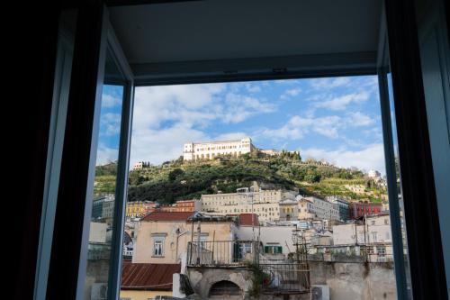 a view of a city from a window at Domus Sibyllina, Palazzo Cavalcanti in Naples