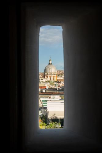 a view of a city through a window at Domus Sibyllina, Palazzo Cavalcanti in Naples