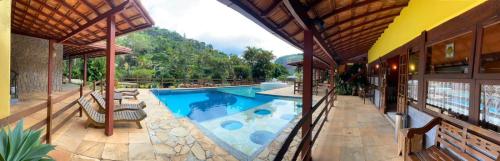 a view of a swimming pool in a house at VILLA MIA DUO in Itaipava