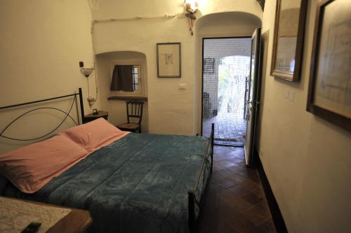 a bedroom with a large bed in a room at Agriturismo La Contessa in Finale Ligure