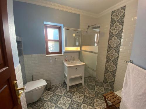 a bathroom with a sink and a toilet and a tub at Private Luxury Villa with Pool in Kaş Peninsula in Kas