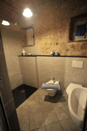 a bathroom with a sink and a toilet at Agriturismo La Contessa in Finale Ligure