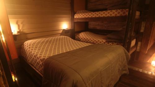 a bedroom with two bunk beds in a room at Narakan Cabo Polonio in Cabo Polonio