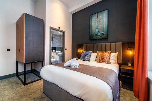 a bedroom with a large bed in a room at EPIC Duke Street Townhouse, City Centre Apartments in Liverpool