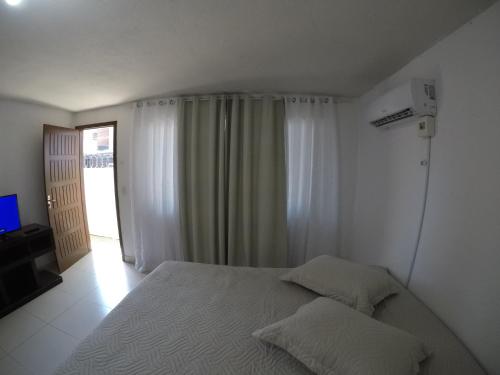 Cama o camas de una habitación en Suite Casal Ar Condicionado