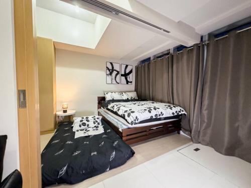 Lova arba lovos apgyvendinimo įstaigoje A2J Luxury 1BR BGC Suite Near Uptown Mall Taguig