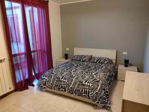 Postel nebo postele na pokoji v ubytování House IL CORALLO