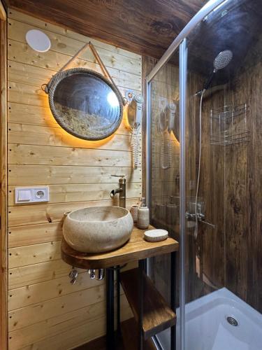 a bathroom with a sink and a mirror on the wall at Sphere Borjomi in Borjomi