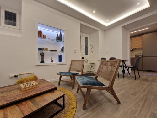 a living room with chairs and a table at Sintra Viscount Apartment - Private Terrace in Sintra