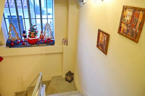 a staircase with a christmas decoration on the wall at Vip Lepanto Port Suites in Nafpaktos