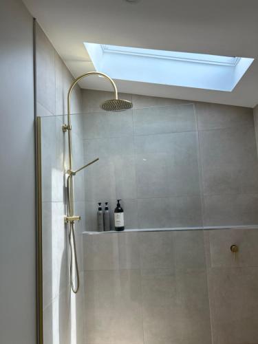 a bathroom with a shower stall with aventricularricularricularricular at Cozy 2 bedroom cottage - Newly renovated, perfect location for best of Ballarat in Ballarat