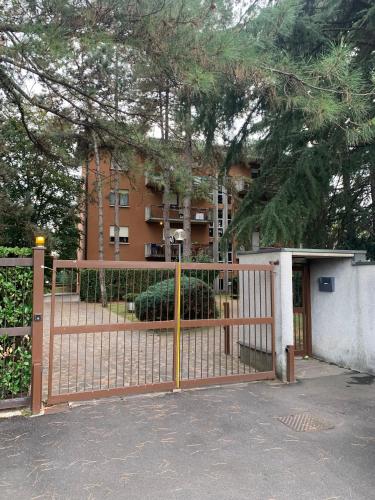 a gate in front of a building with a building at Appartamento brevi periodi "Pedrini's Welcome Home" in Bergamo