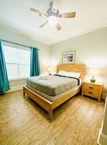 a bedroom with a bed and a ceiling fan at Ocean View Luxury Rental - Sleeps 16 in Myrtle Beach