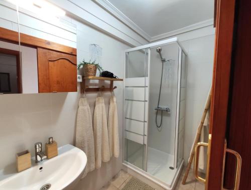 a bathroom with a sink and a shower at Tenerife Flamingo in Palm-mar