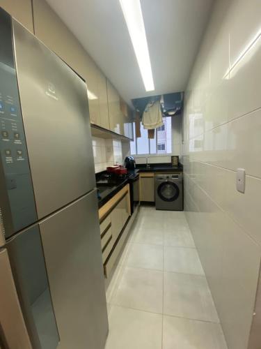 A kitchen or kitchenette at Apartamento 10 minutos de carro das Praias de Manguinhos e Jacaraipe