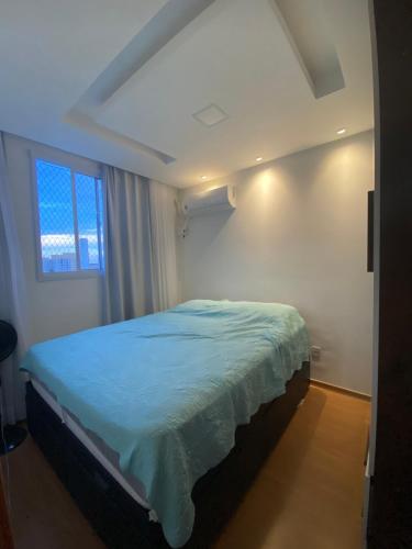 A bed or beds in a room at Apartamento 10 minutos de carro das Praias de Manguinhos e Jacaraipe