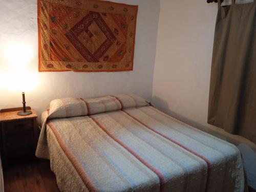 Łóżko lub łóżka w pokoju w obiekcie Hostel Mar y Campo