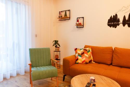 a living room with a couch and a table at GO Jahorina by Olympic Gardens in Jahorina