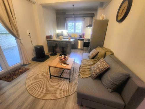 a living room with a couch and a table at Helios Houses - Ioannina in Ioannina