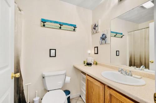 a bathroom with a toilet and a sink at Lake Winnisquam 1 Bedroom Condo with Lake Views in Tilton