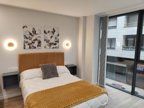 Postel nebo postele na pokoji v ubytování Apartamentos Centro Oviedo Caveda