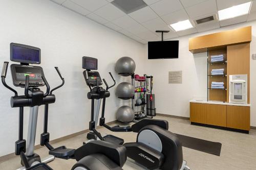a gym with several exercise bikes in a room at SpringHill Suites By Marriott Charleston Airport & Convention Center in Charleston