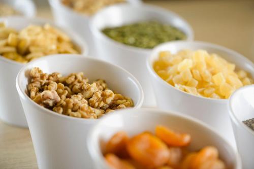 a group of cups filled with different types of food at AC Hotel Som by Marriott in Hospitalet de Llobregat