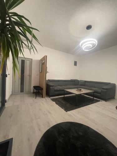 a living room with a couch and a table at Apartman Kis in Jajce