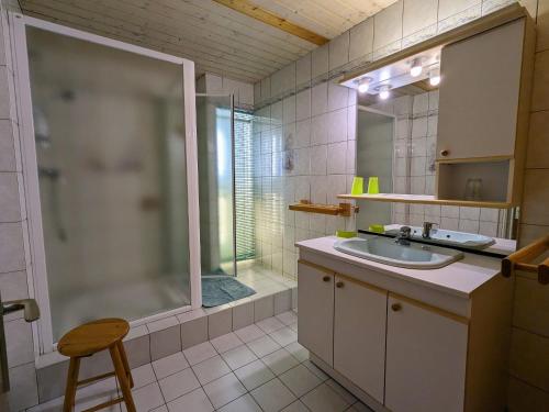 a bathroom with a sink and a shower at Maison de Montagne à La Bresse, 2 Chambres, Confort et Activités, Garage, Wifi Inclus - FR-1-589-152 in La Bresse