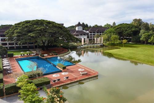 an aerial view of a resort with a swimming pool at Le Meridien Chiang Rai Resort, Thailand in Chiang Rai