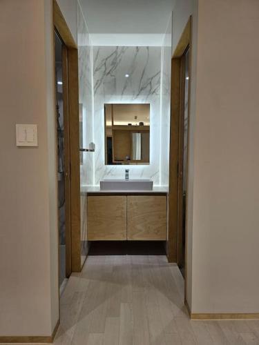 a bathroom with a sink and a mirror at IMSTAY friendly child Eoeum Aewol in Jeju