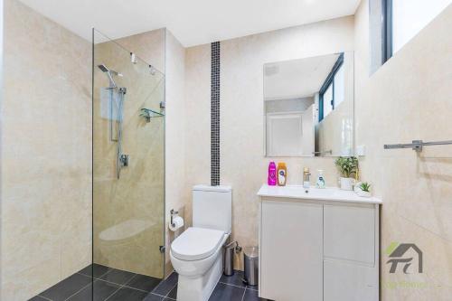 a bathroom with a toilet and a shower and a sink at Wonderful Home in Your Heart in Waitara
