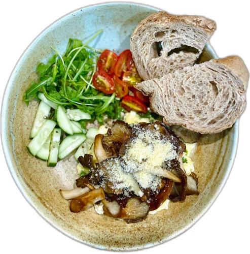 a bowl of food with vegetables and bread at Paddy Boutique House Hoian in Hoi An