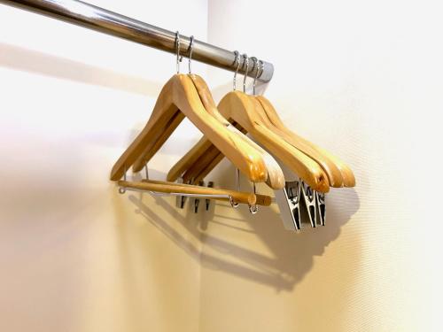 a group of baseball bats hanging on a rack at Hotel Art Stay Naha Kokusai-Dori in Naha