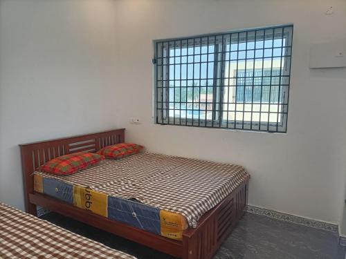 NKS Homestay tesisinde bir odada yatak veya yataklar