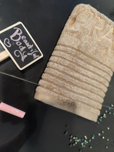 a close up of a brown sock next to a pink lighter at Thai Style Housing in Koh Phangan