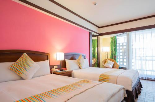 Katil atau katil-katil dalam bilik di Yoho Beach Resort Kenting