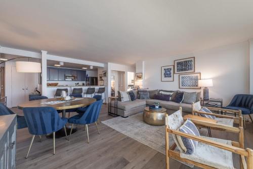 a living room with a couch and a table at VIP Lakefront Condo Amazing Views Pool Pickleball Excellent Location Balcony BBQ in Kings Beach